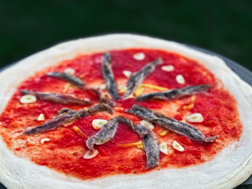 Pizza Marinara Sardellen belegt